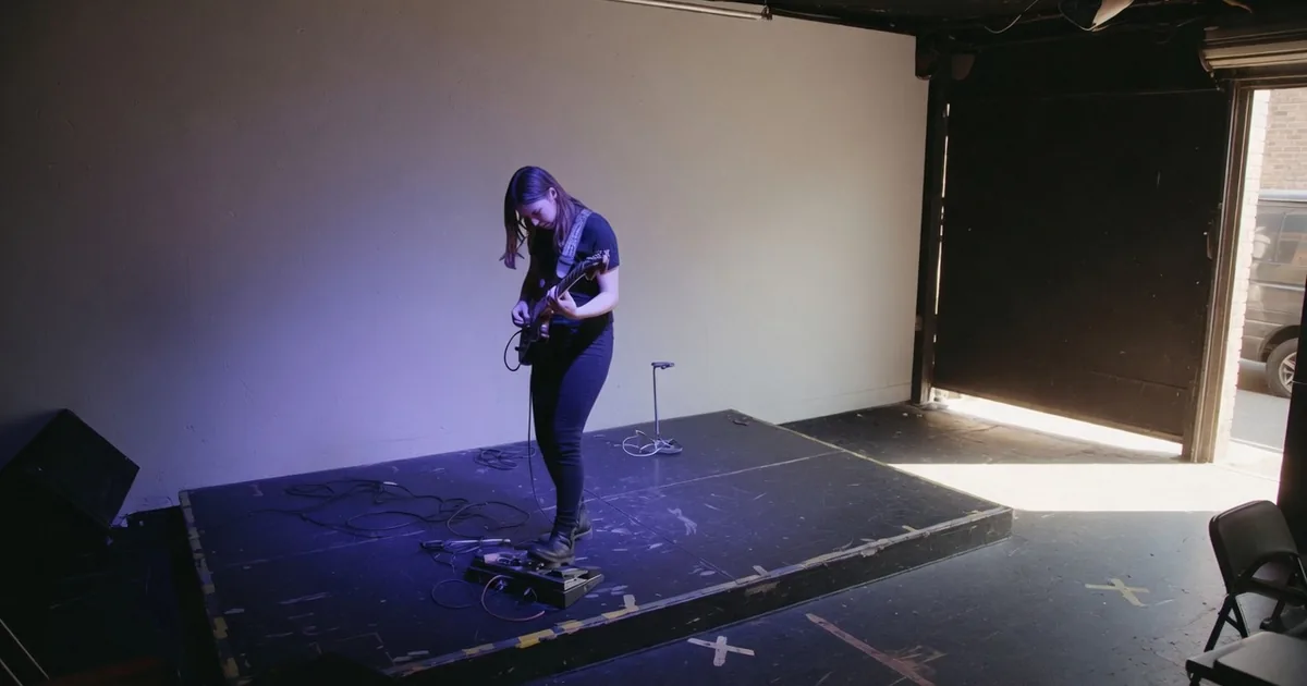 Musician soundchecking on a small club stage